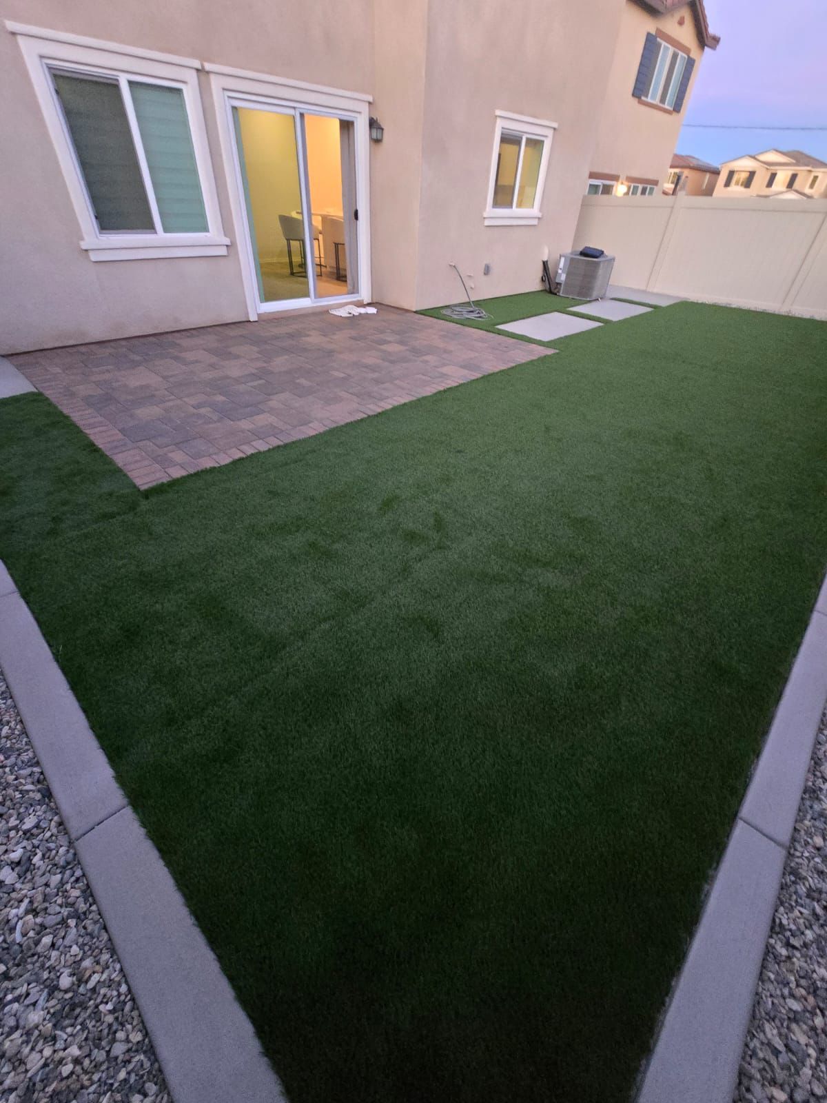 Artificial Turf Backyard With Paver Lounge Area