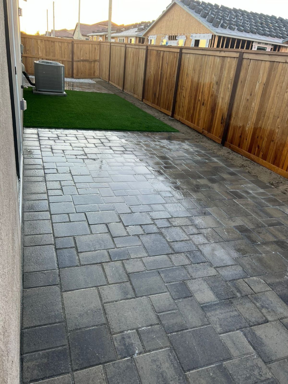 Charcoal Paver Side Yard With Wood Fence