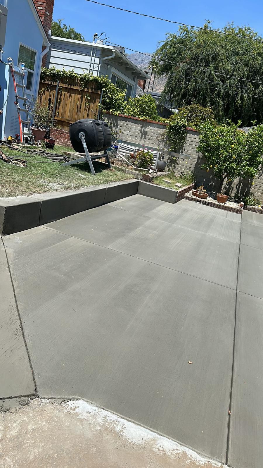 Completed Concrete Driveway From Backyard View