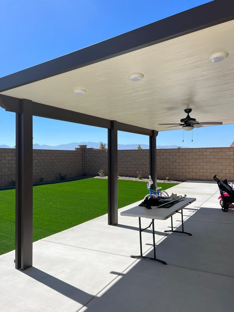 Covered Patio With Turf Backyard and Mountain Views