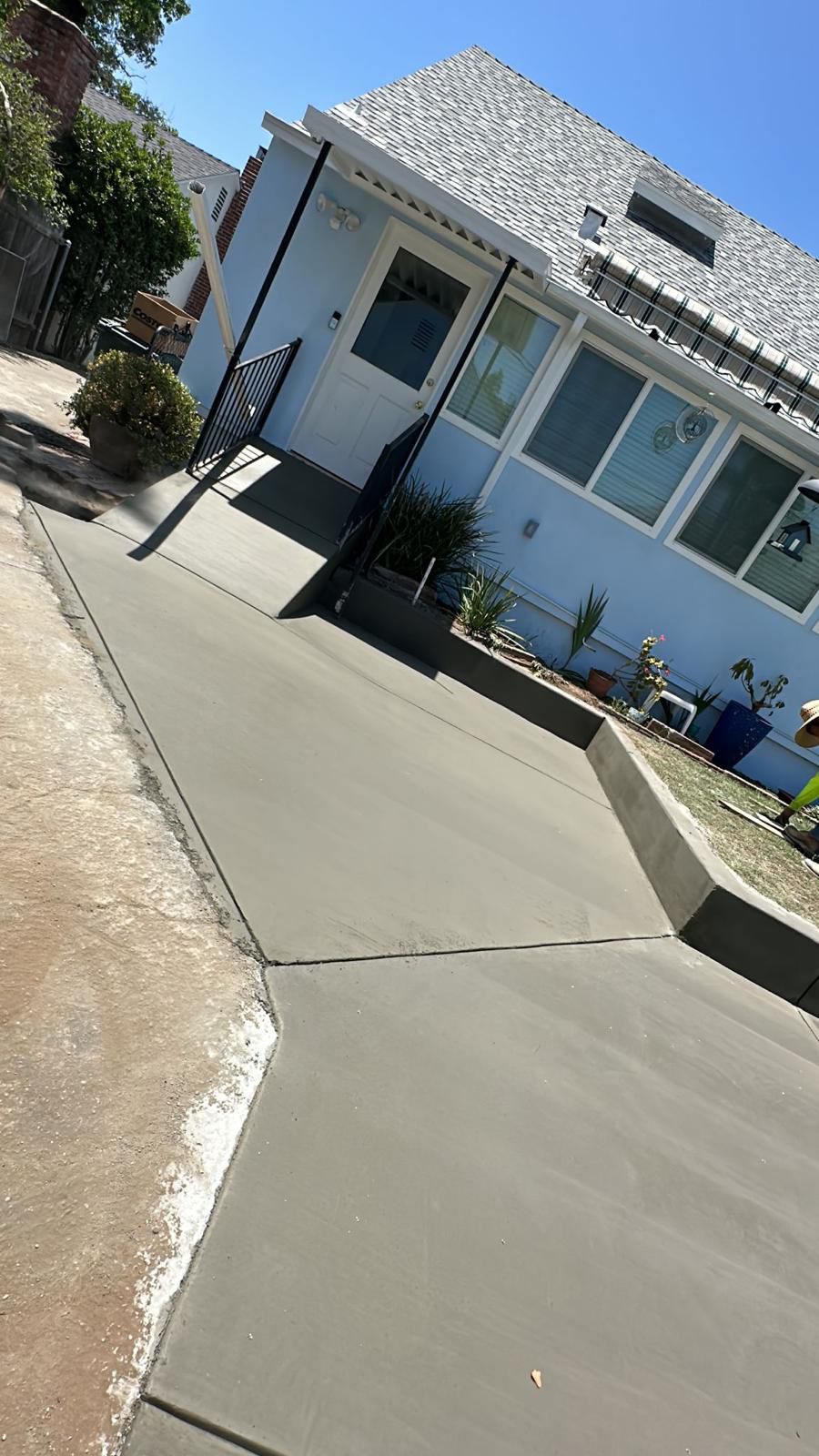 New Concrete Driveway Near Garage Entry