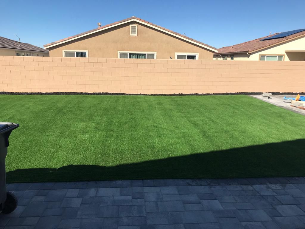 Spacious Turf Backyard With Paver Patio
